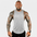 AeroFlex Drop Arm Training Tank worn by a muscular man showcasing tattooed arms, ideal for fitness enthusiasts.