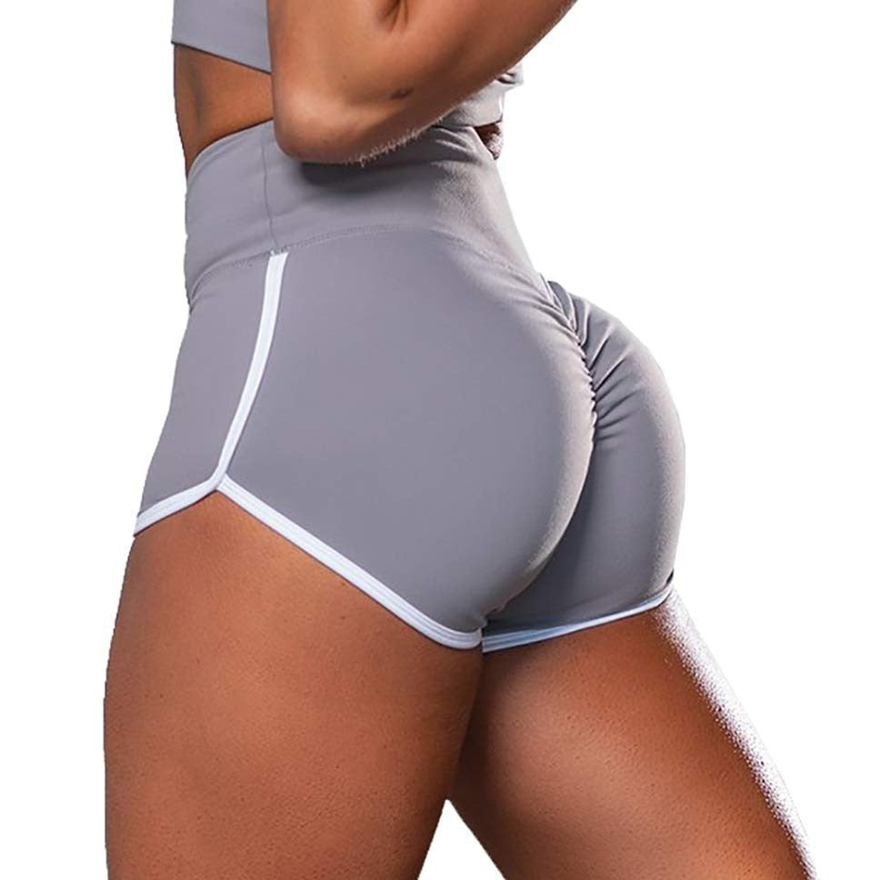 Plus size women wearing high waist solid hip lifting tight running workout shorts