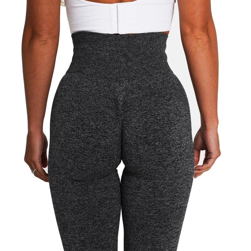 Rear view of a person wearing SculptFlex Seamless High-Waist Performance Leggings showcasing the lift and contour features.