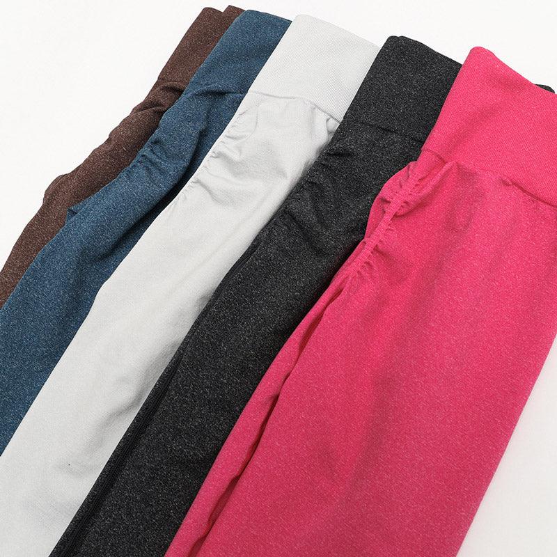 SculptFlex Seamless collection of high-waist performance leggings in various colors including pink, gray, black, blue, and brown.