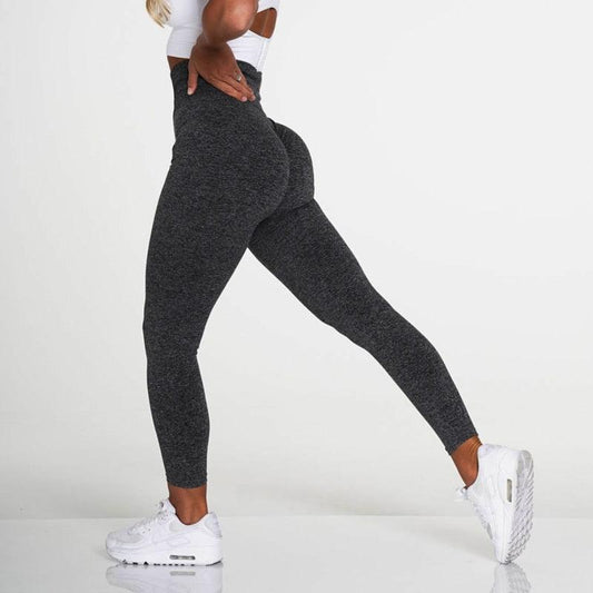 Model wearing SculptFlex Seamless High-Waist Performance Leggings showing perfect figure and streamlined look.