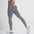 Woman wearing FlexCurve Seamless High-Waist Sculpt Shorts in grey, showcasing comfort and style.