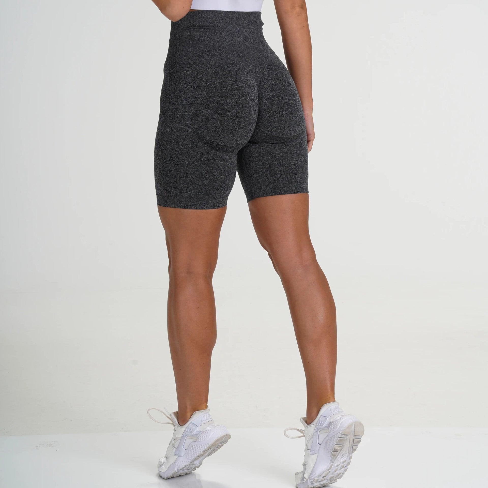 Model showcasing FlexCurve Seamless High-Waist Sculpt Shorts from the back, emphasizing fit and style.