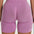Back view of woman wearing FlexCurve Seamless High-Waist Sculpt Shorts in pink color.