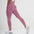 Model wearing FlexCurve Seamless High-Waist Sculpt Shorts in pink, showcasing a flattering fit and style.
