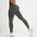Model wearing FlexCurve Seamless High-Waist Sculpt Shorts in gray, showcasing a stylish and flattering fit.