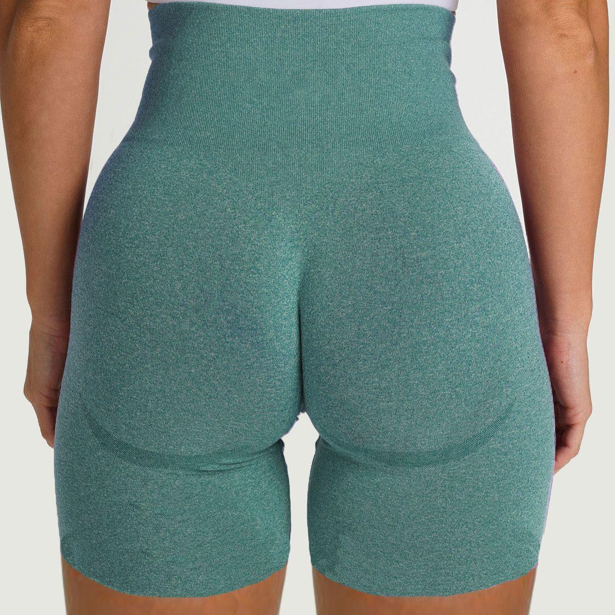 Back view of FlexCurve Seamless High-Waist Sculpt Shorts in green, highlighting their sculpting design and high waist.