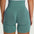 Back view of FlexCurve Seamless High-Waist Sculpt Shorts in green, highlighting their sculpting design and high waist.