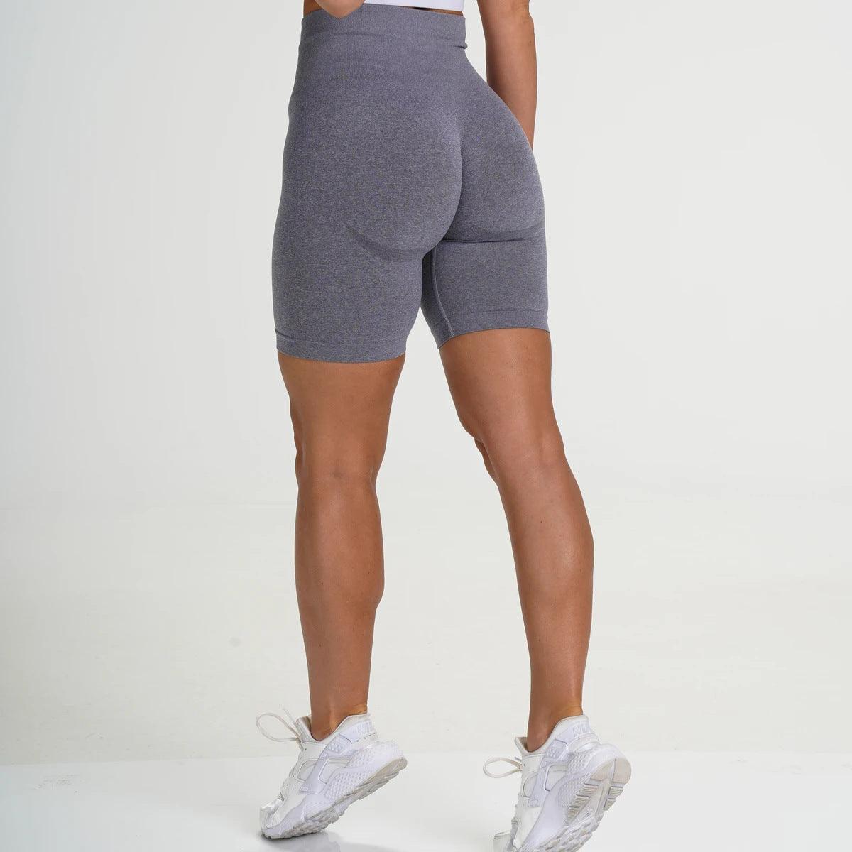 Model showcasing FlexCurve Seamless High-Waist Sculpt Shorts from the back, highlighting comfort and style.