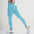 Woman wearing FlexCurve Seamless High-Waist Sculpt Shorts in light blue, showcasing a stylish fit and comfort.
