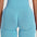 Back view of a model wearing FlexCurve Seamless High-Waist Sculpt Shorts in blue, showcasing fit and comfort.