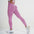 Model showcasing FlexCurve Seamless High-Waist Sculpt Shorts in pink, highlighting a stylish and supportive fit.
